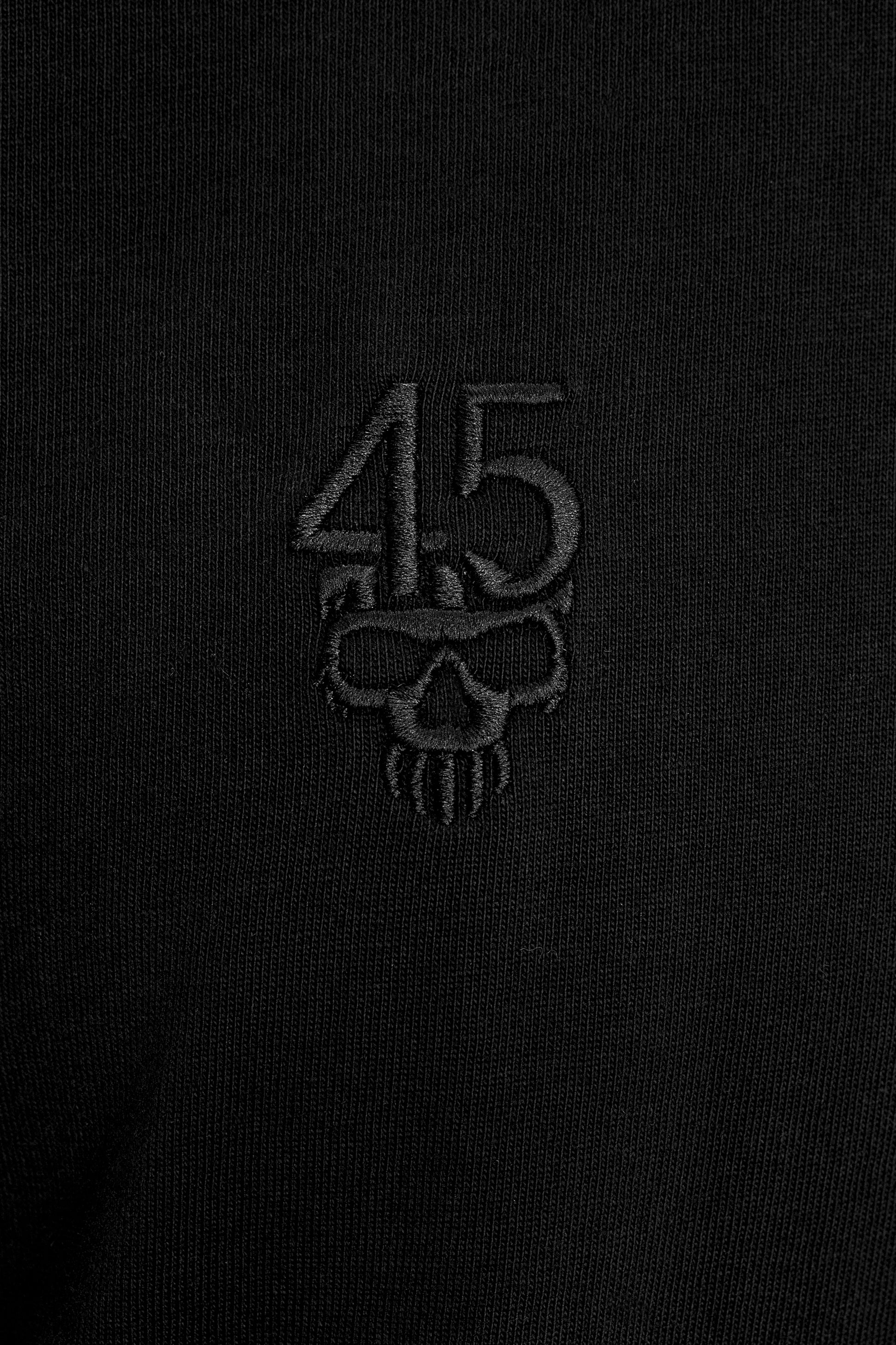 Close-up of tonal 45 skull embroidery on the Forty Five Supply Signature Tee
