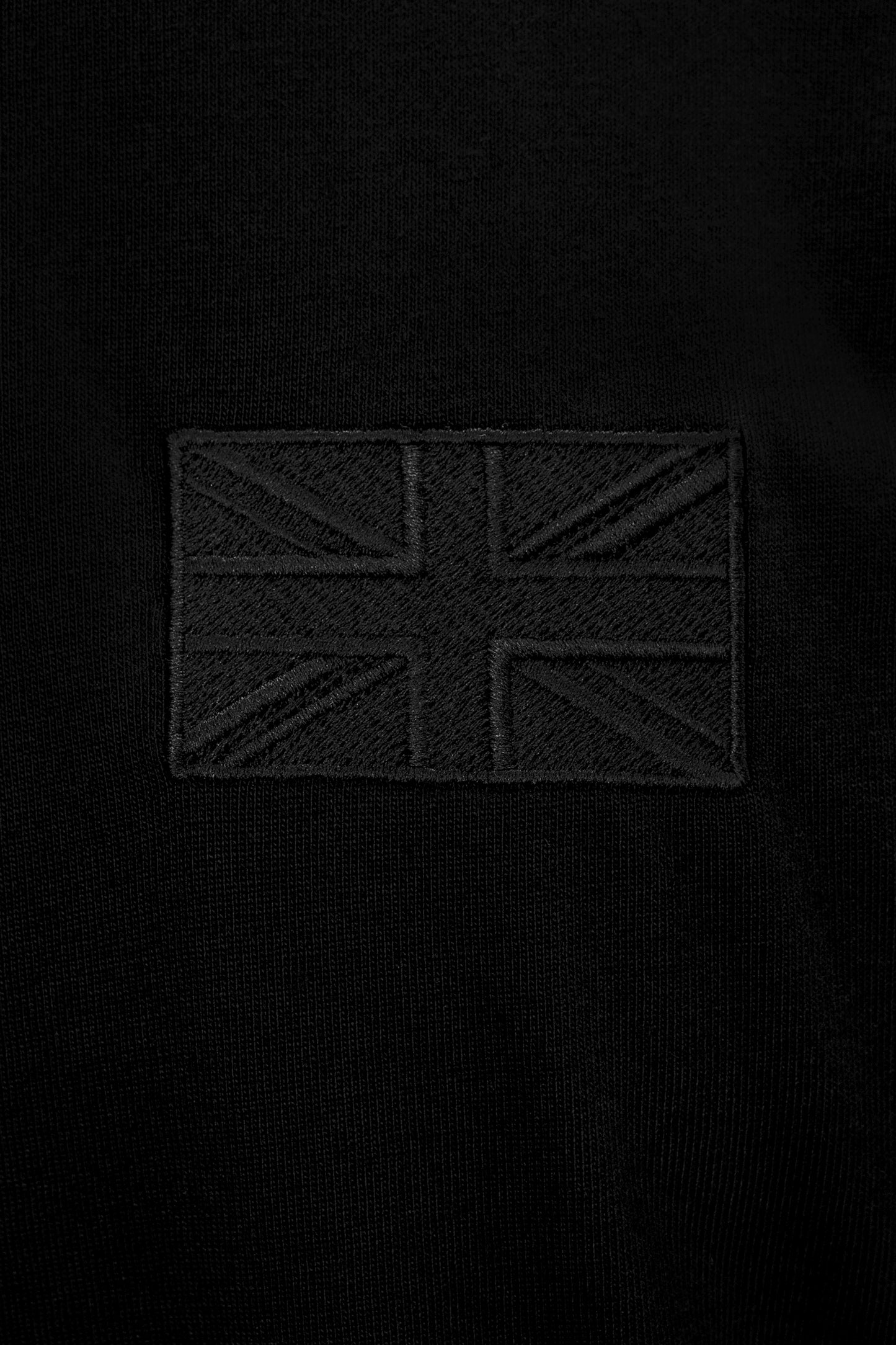 Close-up of tonal Union Flag embroidery on the Forty Five Supply Signature Tee